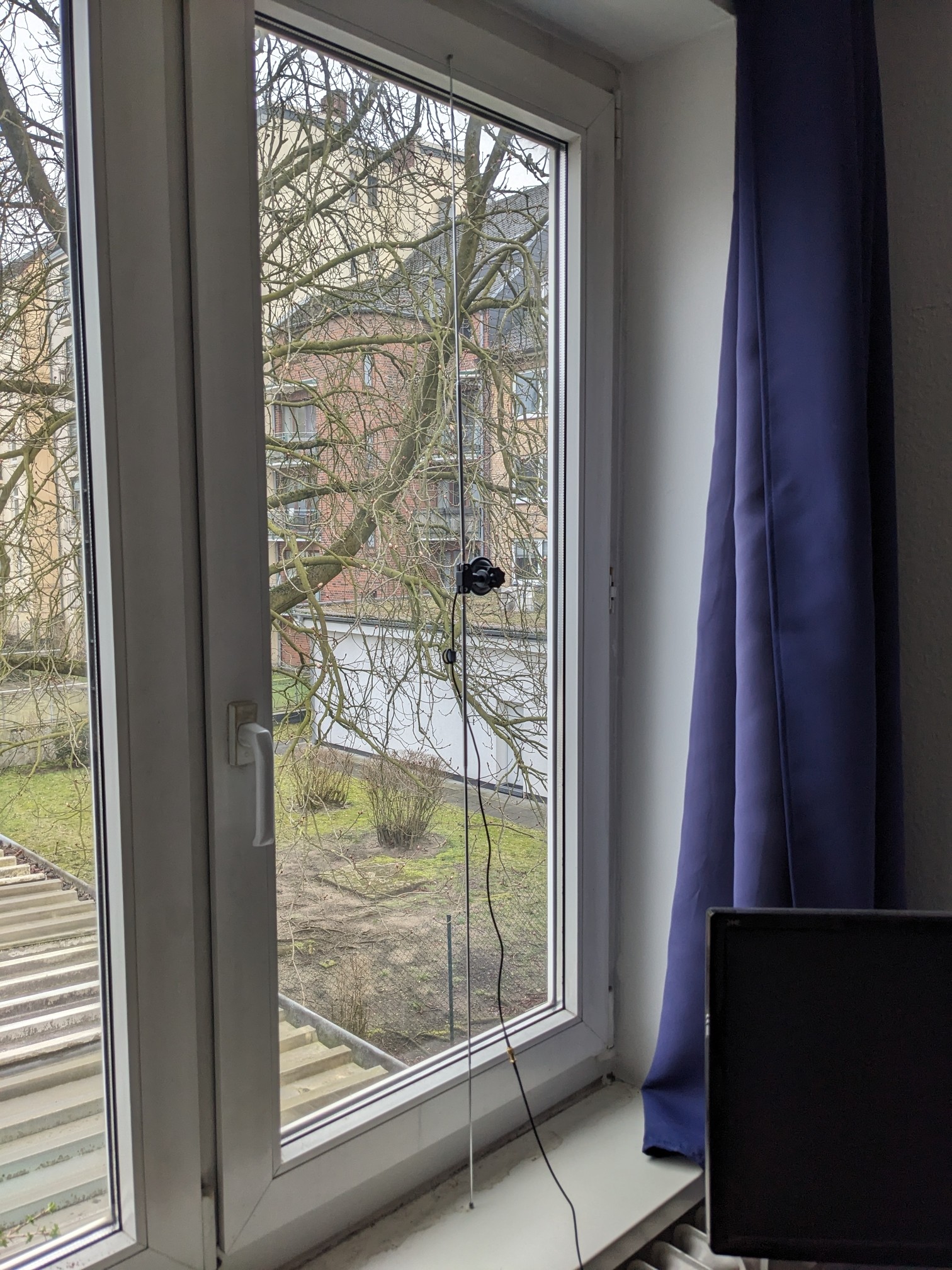 A 1.4 m long, two sided antenna, attached to my window.