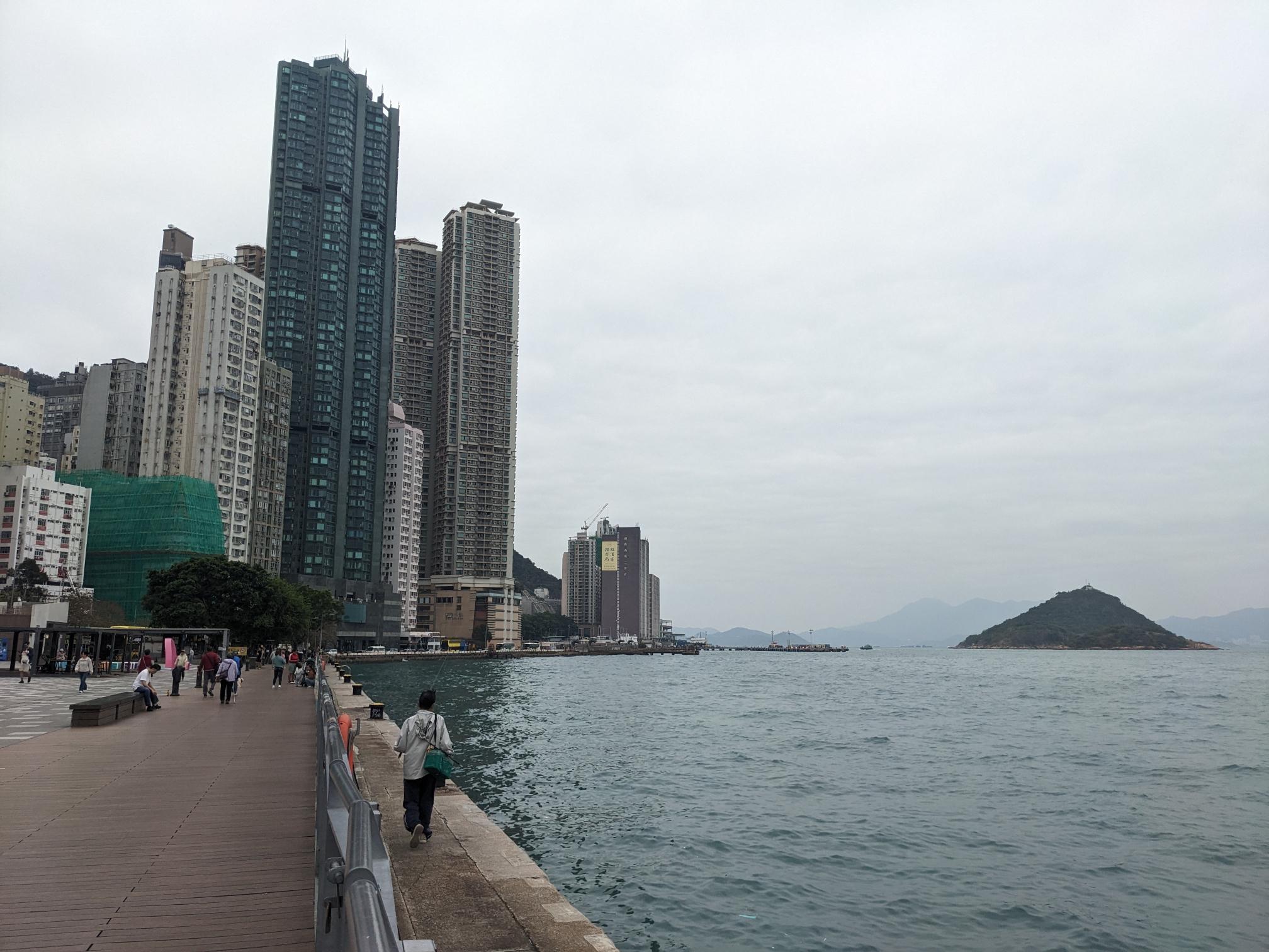 A view with water, skyscrapers, and a little pointy island. A view with water, skyscrapers, and a little pointy island.