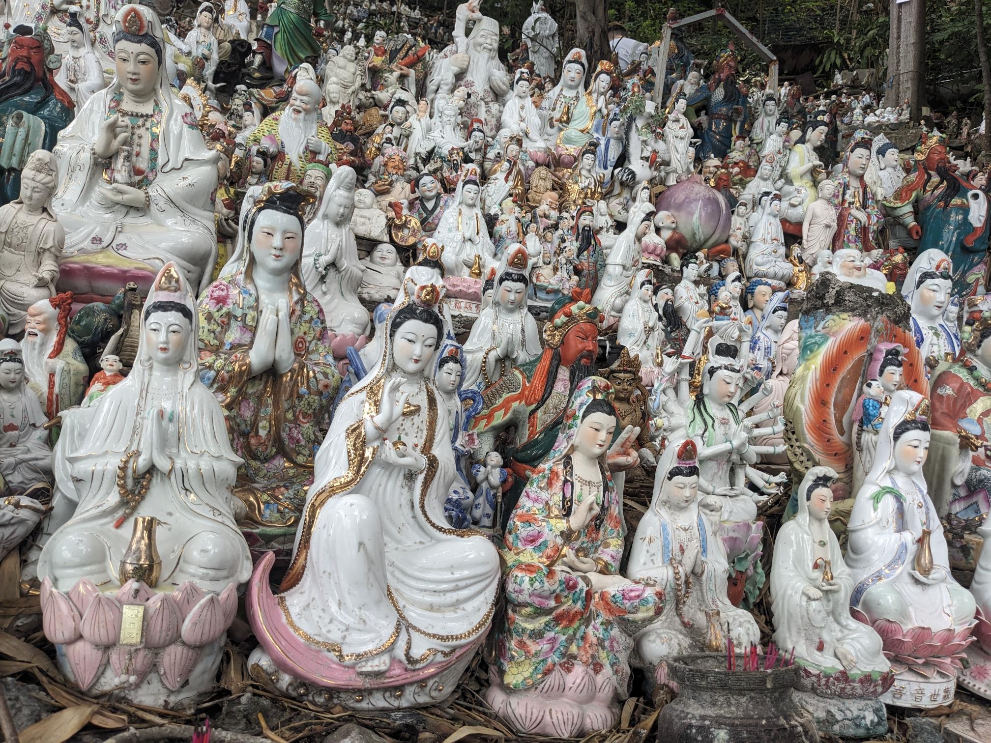 Both photos show hundreds of ceramic deity figures. Both photos show hundreds of ceramic deity figures.