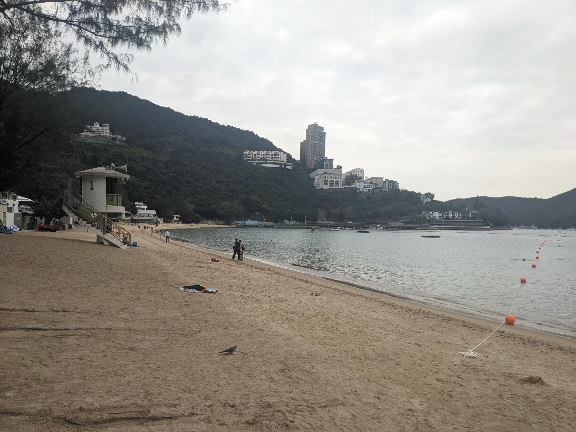 A beach with some pretty high buildings behind it. A beach with some pretty high buildings behind it.