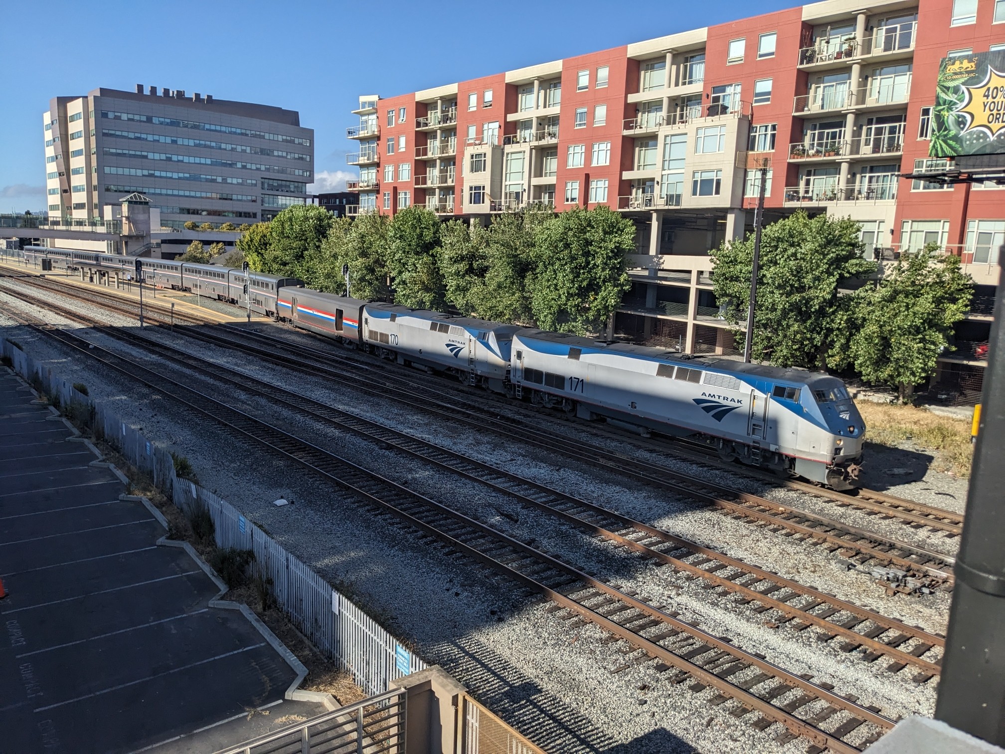 An Amtrak train leaving a train station.