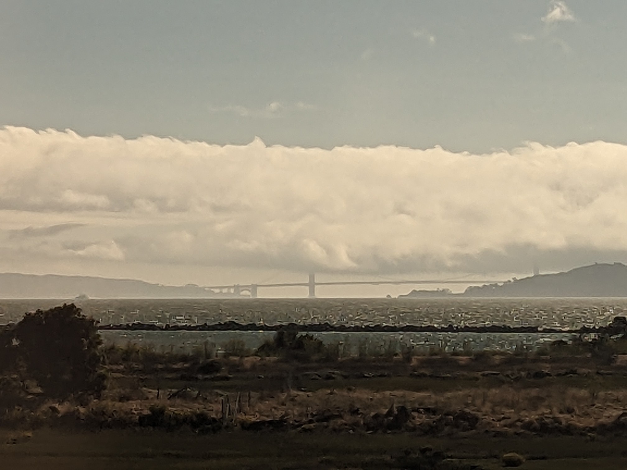 A long bridge in the clouds.