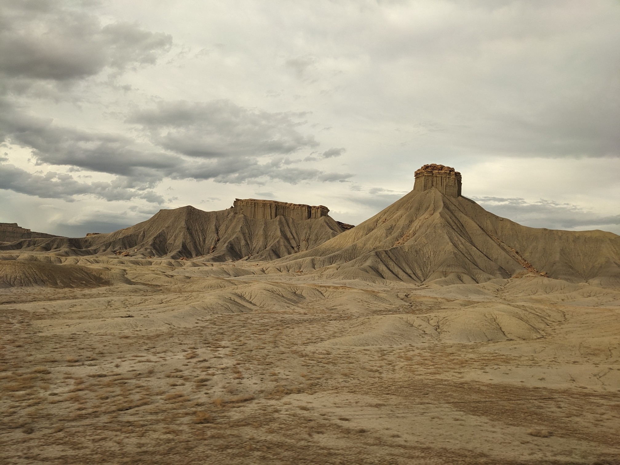 All pictures show sandy, rocky landscape without much plants.