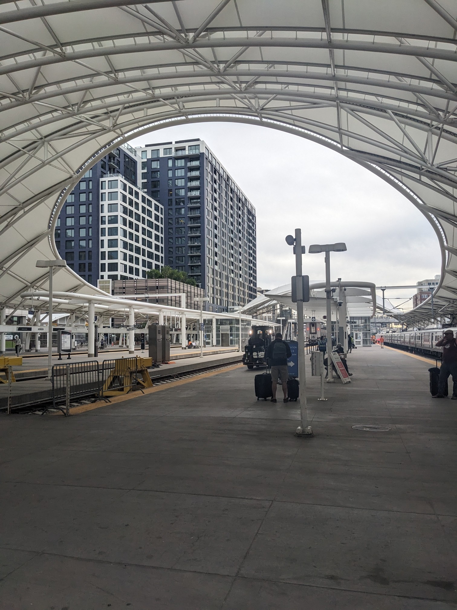 All photos show the station and street scenes in Denver, and mountains in the distance.