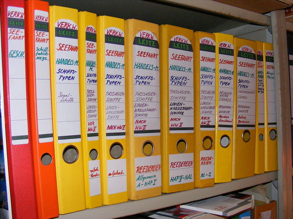 A shelf of ring binders