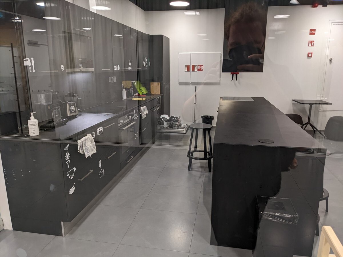 A kitchen behind glass walls.