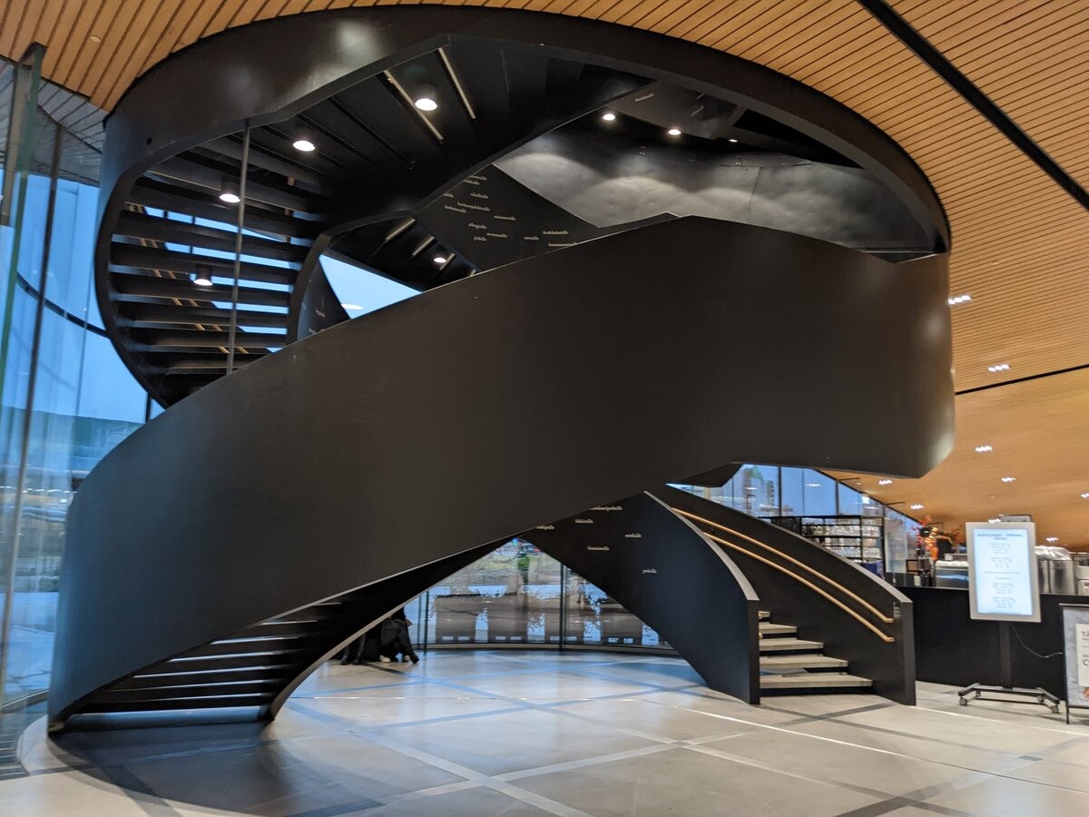 It's shaped in a double helix, and its's all black, covered in Finnish words.