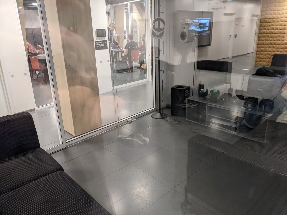 A room with consoles and VR headsets.